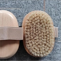 Oval wooden body brush with natural bristles and elastic hand strap for bathing - Beech Wood Small Oval Handheld Boar Bristle Brush 11x7.5cm