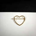 Elegant gold hollow heart-shaped metal hair clip with a polished geometric finish - Gold Hollow Heart