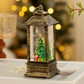 Vintage bronze Christmas lantern with LED light, snowy tree scene, and warm bokeh background - Water-filled / Bronze Christmas Tree