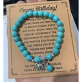 Turquoise bead bracelet with silver elephant charm and kraft paper birthday card - Elephant Birthday Card Style