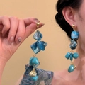 Detail of blue bead drop earrings with gold shell pendant on a neutral background - Blue Irregular Beaded Shell Style (28#)