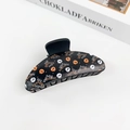 Gothic Halloween hair claw clip in black plastic featuring skull and spider web patterns - Halloween #9 - Crescent