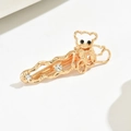 Golden alloy bear hair clip with bow detail and sparkling rhinestones on wavy band - Gold Panda/Bear