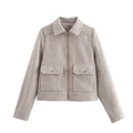Detail view of the elegant oatmeal tweed jacket with zip closure and flap pockets - S / Off White
