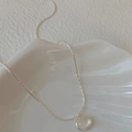 Elegant silver necklace with an oval moonstone pendant on a white shell tray - Oval Transparent Stone Pendant Necklace (XL2917)