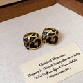 Detail view of gold-plated square stud earrings with black leopard print enamel inlay - Black Gold Spotted Square (Silver Earring Post)