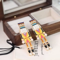 Colorful nutcracker soldier drop earrings with enamel finish and pearl accents - Yellow Pink Orange Blue