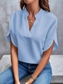 Detail of light blue short sleeve V-neck blouse with elegant notched collar on a model - S / Tops / Blue