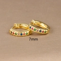 Detailed view of 7mm 18K gold huggie earrings with colorful inlaid rainbow zircons - 7mm / Gold