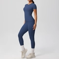 Detail of high-waisted yoga leggings with side pockets and slimming blue gym top - S / Navy Blue