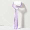 Detail of ergonomic purple handle and white spiked massage roller for head and face therapy - Purple
