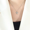 Silver elephant pendant necklace with beaded O-chain on model in white suit - Steel