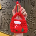 Handmade red knit earphone pouch with Christmas stocking patch and star keychain - Stocking Style
