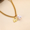 Minimalist golden necklace with letter Q pendant and a baroque pearl accessory - Letter Q Necklace
