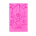Rosa Silikonform mit verschiedenen Flügel- und Zahnradmustern für Fondantkuchen - Rosa