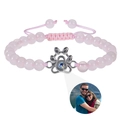 Detail of pink beaded bracelet with silver paw pendant featuring custom photo projection - Rose Quartz (Customized)