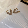 Detail view of V-shaped heart earrings in taupe enamel finish with gold metal trim - Light Coffee Enamel Heart Huggie Earrings