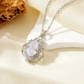 Close-up of a pear-shaped cubic zirconia pendant with baroque hollowed silver metal work - Silver Water Drop White Zirconia (T008)