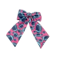 Detailed view of pink fabric hair bow with dark blue football pattern and long ribbon - Pink Football