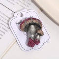 Close-up of vintage mushroom brooch with rose red rhinestones and antique silver finish - Style 5 (Mushroom Shape)