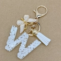Letter W keychain with white resin, gold butterfly charm and tassel for bags - Letter W