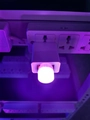 Creative USB night light in white finish glowing warm white light in a power strip - Purple