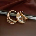 Detail of 14K gold plated chunky C-shape hoop earrings on a vintage dark fabric background - 16# Golden Mirror Polished Streamlined C-Shape Earring