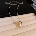 Elegant two-tone heart pendant necklace on a sleek snake chain in a luxury display box - Regular Silver Necklace