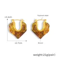 Dettagli sulle dimensioni degli orecchini a cuore dorati con intarsio in resina - Oro