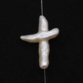 Macro shot of cross-shaped baroque freshwater pearl with natural iridescent white luster - 20x30-30x50mm / Straight Hole