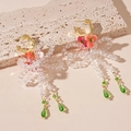 Detalle de pendientes florales con lazo de cristal y borlas verde esmeralda largos - Flor Rosa Lazo Borla (Pin De Plata 925)