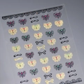 Autocollants nail art avec nœuds et papillons dorés et argentés aux reflets pailletés - M-915 Plat avec colle gelée (M-915)