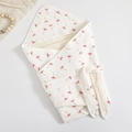 Folded white cotton gauze baby swaddle blanket with red dandelion print and ribbon ties - 90*90cm / Dandelion