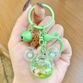 Green cartoon liquid sand keychain with glittery star filling and matching bell charm - Mini Mickey Head Sparkle - Green
