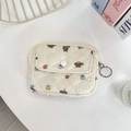 Close-up of beige quilted storage pouch with cute cartoon bear and cupcake patterns - Bread Doggy