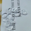 Macro detail of transparent oval amethyst stones scattered on a white background card - 6*8mm / White Crystal