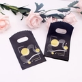 Black plastic shopping bag with gold circle pattern and wave edge for jewelry - No. 93 (Trend Pioneer)