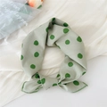 Elegant light green cotton linen neck scarf with dark green polka dots tied in a knot - Ink Dot Green