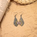 Close-up of vintage sunflower teardrop earrings with antique silver finish and hook - Antique Silver Sunflower Rhombus