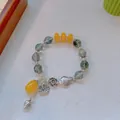 Ethnic style beaded bracelet with green jade-like gems and lotus fish silver charms - Green Ghost: Fish Playing Among Lotus Leaves