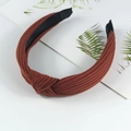 Knitted cotton headband for women featuring a stylish knotted design in brownish red - Orange Red