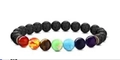 Chakra energy bracelet featuring 8mm black lava stones and seven colorful gemstone beads - Multi-color