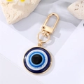 Blue Evil Eye keychain with gold alloy frame and lobster clasp on white background - 25mm / Gold