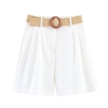 Detail of white summer shorts featuring a beige woven belt and round wooden buckle detail - XS / White