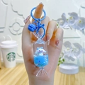 Blauwe drijfzand sleutelhanger met cartoon hondfiguur, bijpassende bel en blauwe ring - Snoep Cartoon Hond / Blauw