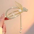 Golden rabbit hair claw clip with rhinestones, a large pearl, and long tassels - Gold Fishtail Twist Clip