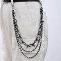Three-layer punk jeans chain with sharp spikes in dark grey metal finish on white trousers - Triple Chain Long Style (X500-5)