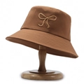 Minimalist caramel brown cotton bucket hat with an embroidered bow on the front - Yellow Brown