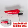 Macro detail of a 7cm red chili hair clip made of shiny resin on a metal duckbill clip - Long Red Chili