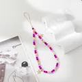 Detail of beaded phone strap with pink faceted beads and golden star pendants - Rose Red